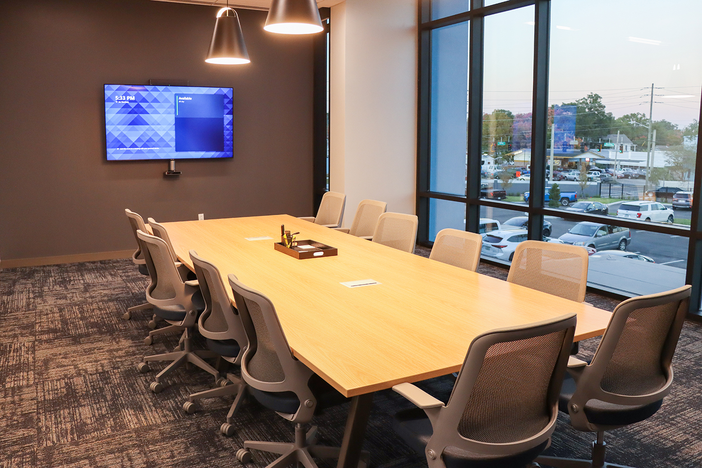 Large businese conference room with 2 pedestal lights over the table